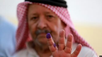 a jordanian man displays his ink stained finger after casting his vote in parliamentary elections at a polling station in al salt near the capital amman on sept ember 10 2024 photo afp