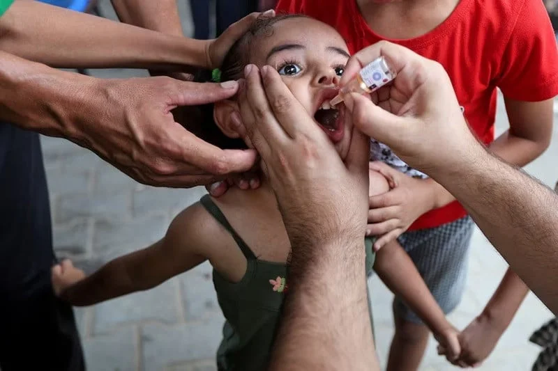 a palestinian girl is vaccinated against polio at a united nations healthcare center in deir al balah in the central gaza strip september 1 2024 photo reuters
