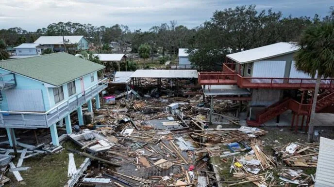 With 130 dead from Hurricane Helene, Biden defends US government response