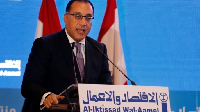 Egypt’s prime minister pauses televised news conference after falling ill