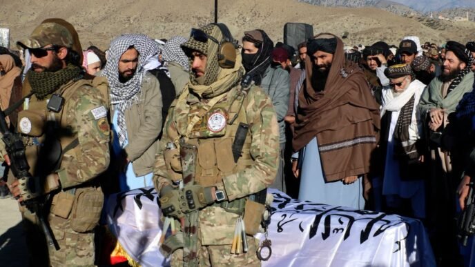 Thousands attend the funeral of a Taliban minister killed by an Islamic State suicide bomber