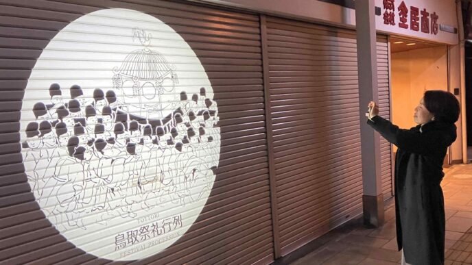 Shadows on shutters: Art brings new life to quiet Japanese shopping street