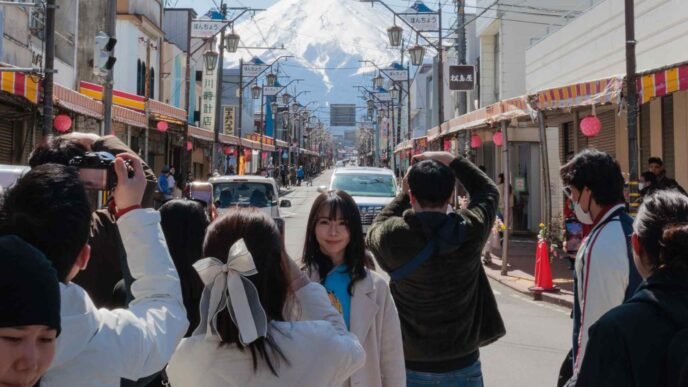 Asian tourists flock to Mount Fuji for the perfect shot