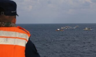 Led by a mothership apparently carrying barrels of fresh water and fuel, a group of Philippine fishing ships attempt to conduct right-infringing activities in waters around China