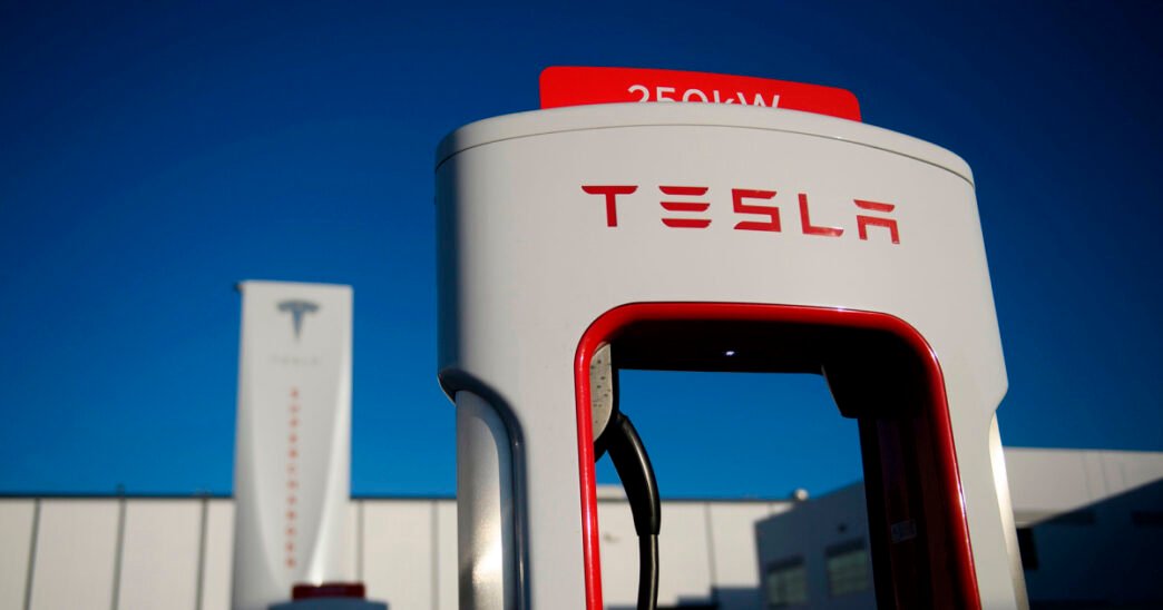 Man charged with assault at Tesla dealership after driving car at protesters