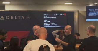 Passengers at JFK await flight information after Heathrow closure