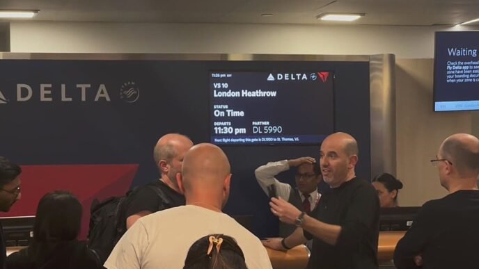 Passengers at JFK await flight information after Heathrow closure