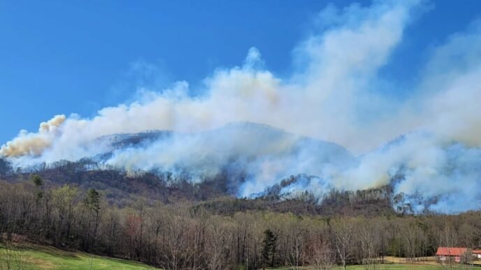 Wildfires continue to scorch Carolinas, burning homes and forcing evacuations