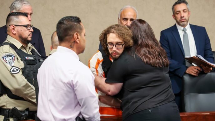A woman hugs the man who fatally shot her brother and 22 more in a racist attack at a Texas Walmart