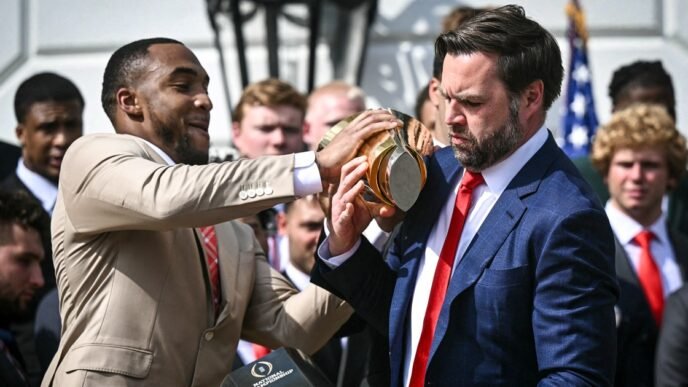 JD Vance fumbles Ohio State's championship trophy during White House visit
