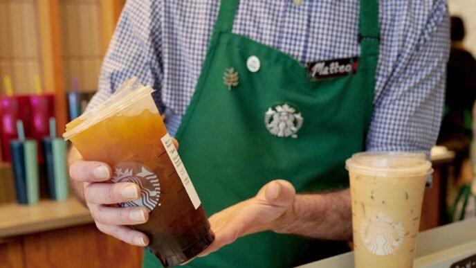 Starbucks imposes new limits on what baristas can wear under their green aprons