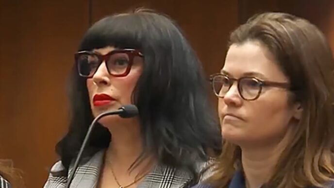 Author and wife of Weezer bassist appears in court with charges yet to be filed