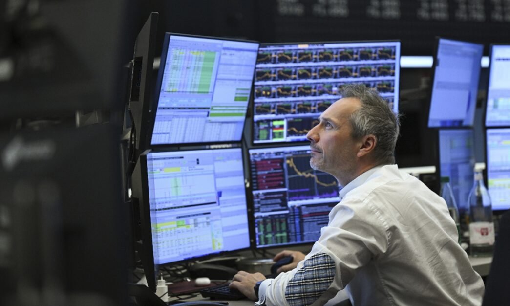 A trader watches monitors on the trading floor of the Frankfurt Stock Exchange on April 10, 2025. Photo: VCG
