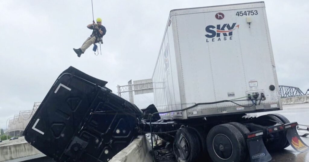Kentucky firefighters make daring rescue to save truck dangling on overpass