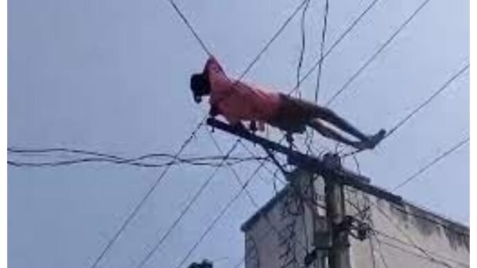 Mentally challenged youth climbs electric pole, rescued