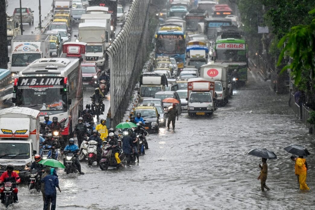 Storms kill 14 in Pakistan and flooding sparks chaos in Mumbai as early monsoon batters South Asia