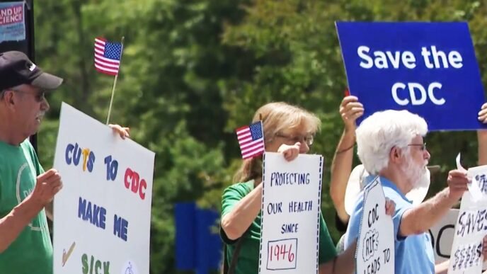 CDC staff and retired workers call for Kennedy’s resignation in a protest outside headquarters