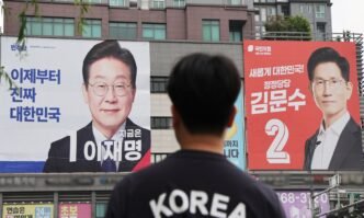 Banners for presidential candidates -- Lee Jae-myung (L) of the liberal Democratic Party and Kim Moon-soo (R) of the conservative People Power Party -- hang on a building in Uiwang, South Korea, 02 June 2025, on the eve of the presidential election. Photo: VCG