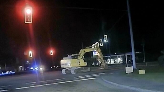 Not-so-hot pursuit of burglary suspect sees police cars chase tractor excavator at walking pace