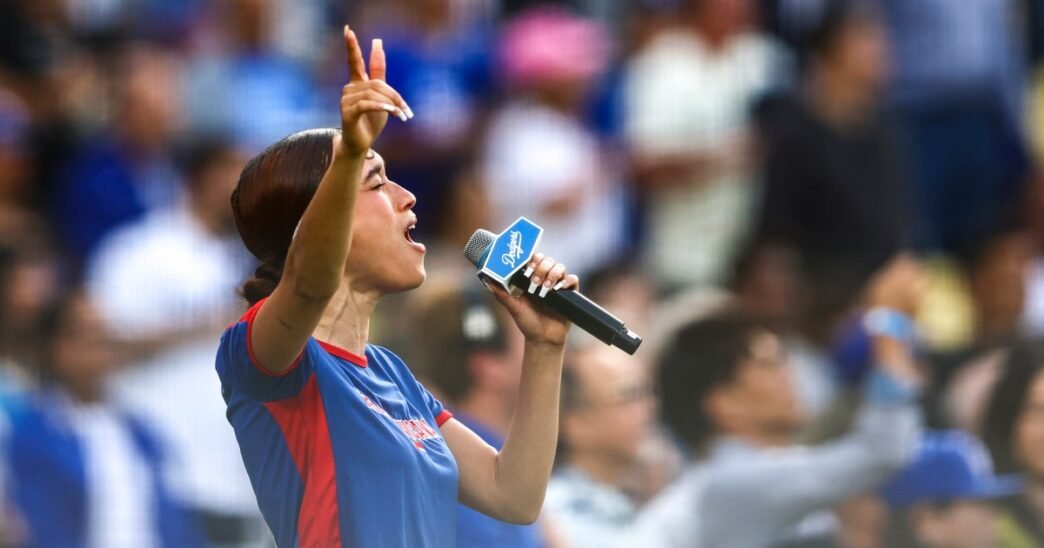 Singer Nezza, at Dodger Stadium sings national anthem in Spanish in protest of L.A. immigration raids