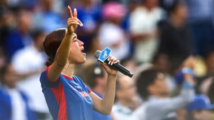 Singer Nezza, at Dodger Stadium sings national anthem in Spanish in protest of L.A. immigration raids