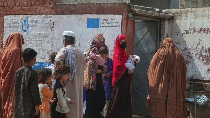 Thousands of Afghans are fleeing Iran every day to escape war and deportation