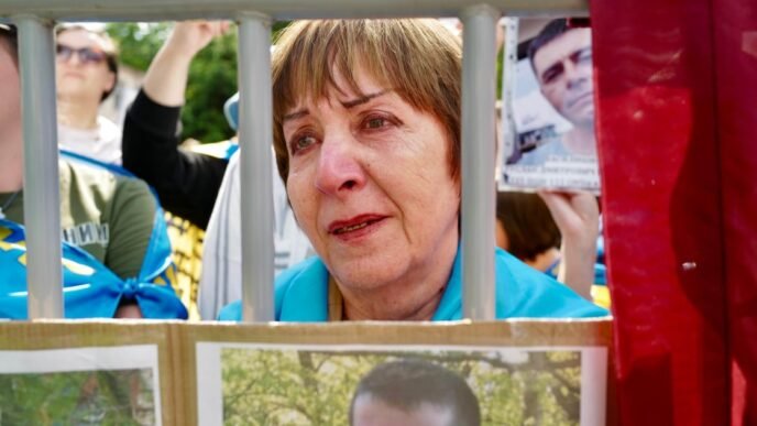 Ukrainians hope for news of loved ones among POW swap with Russia